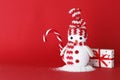 Creative snowman with gifts, sweet candy cane