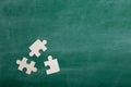 Creative solution for idea - business concept, jigsaw puzzle on the blackboard