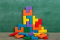 Creative solution for idea - business concept, jigsaw puzzle on the blackboard Royalty Free Stock Photo