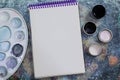 Creative space. The working space of the artist on the shabby table: paint gouache, notebook Royalty Free Stock Photo