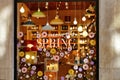 Creative Spring claim lettering and floral composition on lamps and lightbulbs design shop window