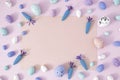 Creative Spring Easter concept on pastel purple background. Painted eggs and carrots with copy space for note or invitation. Flat Royalty Free Stock Photo