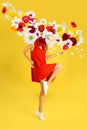 Creative spring composition. Dancing girl and flowers splash Royalty Free Stock Photo