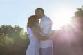 Creative St Valentine day photo of international couple, sunlight,sky,trees on background