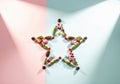 Creative Star Shape with Pinecones and Berries on Pastel Background.Top view winter Christmas decor Royalty Free Stock Photo