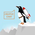 Creative start and creative idea concept. Penguin begins to take off with the help of Rocket