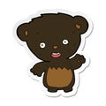A creative sticker of a cartoon black bearcub waving Royalty Free Stock Photo