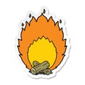 A creative sticker of a cartoon blazing camp fire