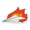 A creative sticker of a cartoon burning paper airplane Royalty Free Stock Photo