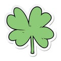 A creative sticker of a cartoon four leaf clover