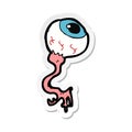 A creative sticker of a cartoon gross eyeball