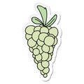 A creative sticker of a quirky hand drawn cartoon bunch of grapes