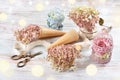 Creative still life with dried hydrangea flowers in wafer cones