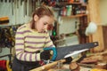 Creative student doing his project in workshop. Boy in the workshop makes crafts with coconut. School, development and learning Royalty Free Stock Photo