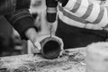 Creative student doing his project in workshop. Boy in the workshop makes crafts with coconut. School, development and learning Royalty Free Stock Photo
