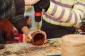 Creative student doing his project in workshop. Boy in the workshop makes crafts with coconut. School, development and learning Royalty Free Stock Photo