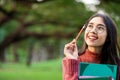 Creative student girl thinking or planning future. Royalty Free Stock Photo