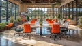 Creative studio workspace with large windows and vibrant orange chairs during daytime Royalty Free Stock Photo