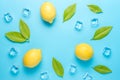 Creative summer composition with lemon and ice cubes on blue background. Minimal drink concept Royalty Free Stock Photo