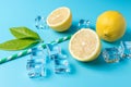 Creative summer composition with sliced lemon, straw and ice cubes on blue background. Minimal drink concept Royalty Free Stock Photo