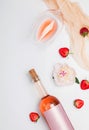 Creative summer flat lay with rose wine, delicious strawberries and beautiful peonies Royalty Free Stock Photo