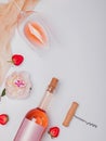 Creative summer flat lay with rose wine, delicious strawberries and beautiful peonies Royalty Free Stock Photo