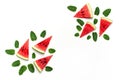 Creative summer food concept. Watermelon pattern. Juicy slices of ripe red watermelon and mint leaves on white background. Flat Royalty Free Stock Photo