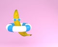 Creative summer layout made of banana with blue pool float and s