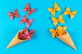 Creative summer layout made of ice cream cone, waffle cones and colored pasta semolina