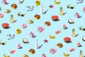 Creative summer pattern made with various summer food and summer accessories on bright blue background. Minimal summer concept Royalty Free Stock Photo