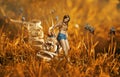 Creative surreal photo montage with girl near the giant shoe Royalty Free Stock Photo