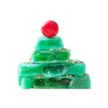 Creative sweet Christmas tree made of pieces of green split lollipop stacked in slide.