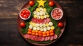 Creative table setting for the holiday, a Christmas tree made of food. Cheese eggs sausage and tomatoes on a plate Royalty Free Stock Photo