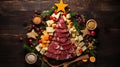 Creative table setting for the holiday, a Christmas tree made of food. Cheese sausage and various vegetables. Wooden