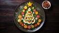 Creative table setting for the holiday, a Christmas tree made of food. Cucumbers, Tomatoes, greens and a star of cheese Royalty Free Stock Photo