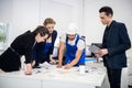 A creative team of business people at the meeting in the conference room. Two successful businesswomen and two Royalty Free Stock Photo