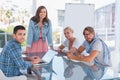 Creative team having meeting and smiling at camera Royalty Free Stock Photo