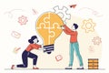 Creative teamwork involves two individuals collaborating to fit puzzle pieces into a light bulb symbolizing innovation and problem Royalty Free Stock Photo