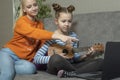 Creative teenagers friends with musical instruments, acoustic guitar and ukulele Royalty Free Stock Photo