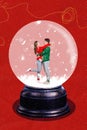 Creative template collage image of charming smiling couple dancing together iside x-mas snow ball isolated red color Royalty Free Stock Photo