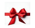 Red ribbon bow on card note white background wrapping. Copy text space Royalty Free Stock Photo