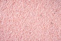Creative texture background, pink pebbles or coarse sand Royalty Free Stock Photo