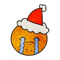 A creative textured cartoon of a orange wearing santa hat