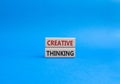 Creative thinkig symbol. Wooden blocks with words Creative thinkig. Beautiful blue background. Business and Creative thinkig