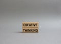 Creative thinkig symbol. Wooden blocks with words Creative thinkig. Beautiful grey background. Business and Creative thinkig