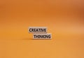 Creative thinkig symbol. Wooden blocks with words Creative thinkig. Beautiful orange background. Business and Creative thinkig Royalty Free Stock Photo