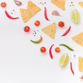 Creative Top view flat lay of fresh mexican food ingredients with tortilla nachos chips garlic pepper lime tomatoes on white table