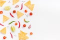 Creative Top view flat lay of fresh mexican food ingredients with tortilla nachos chips garlic pepper lime tomatoes on white table Royalty Free Stock Photo