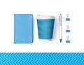 Creative top view flat lay of woman desk with with blue stationery set. Notepad, pen, clip and coffee cup Royalty Free Stock Photo