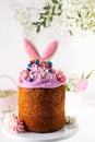 Creative traditional easter cake decorated with a bunny ears. Easter cake decoration.